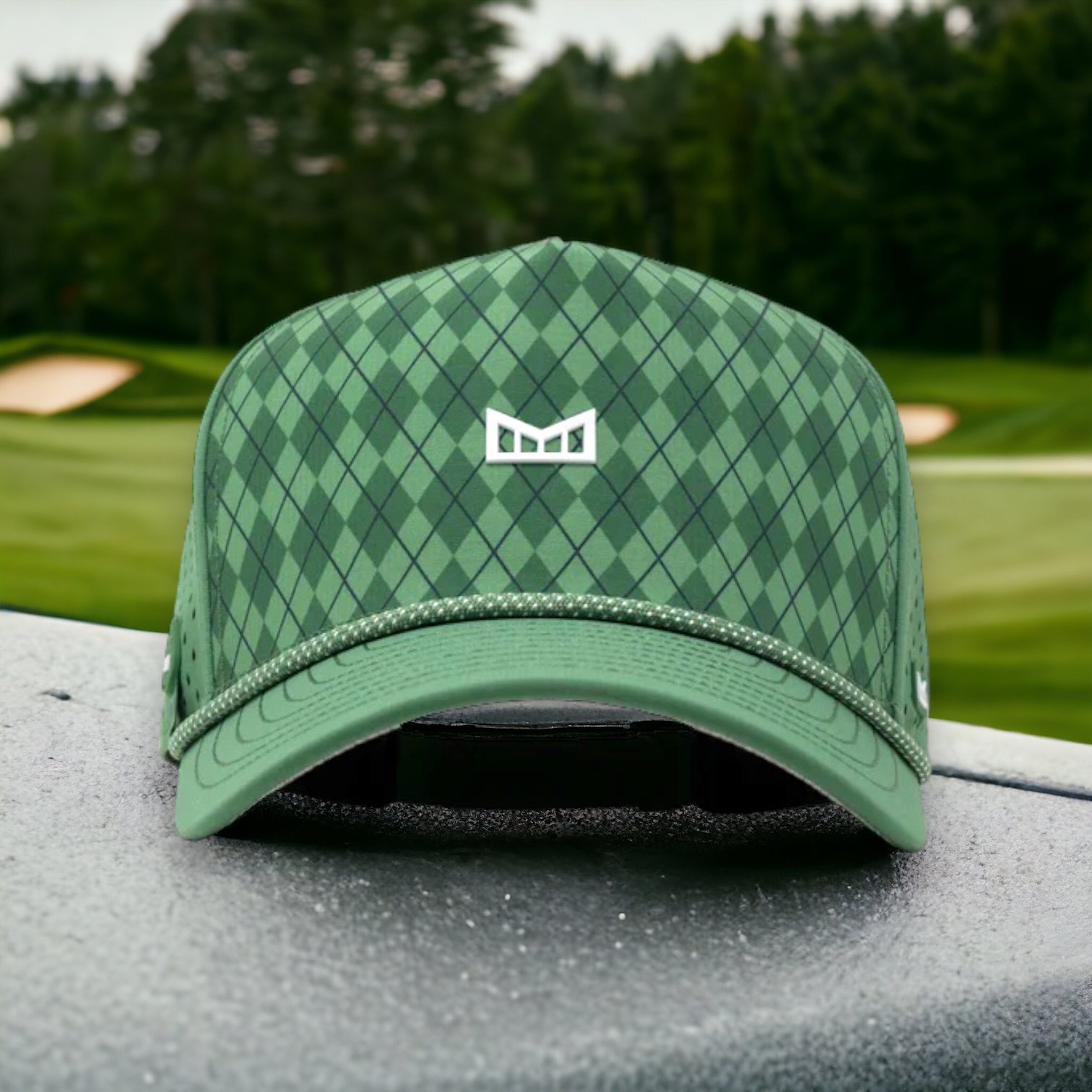 Melin golf hat in argyle green pattern with a golf tee holder on the side of the hat